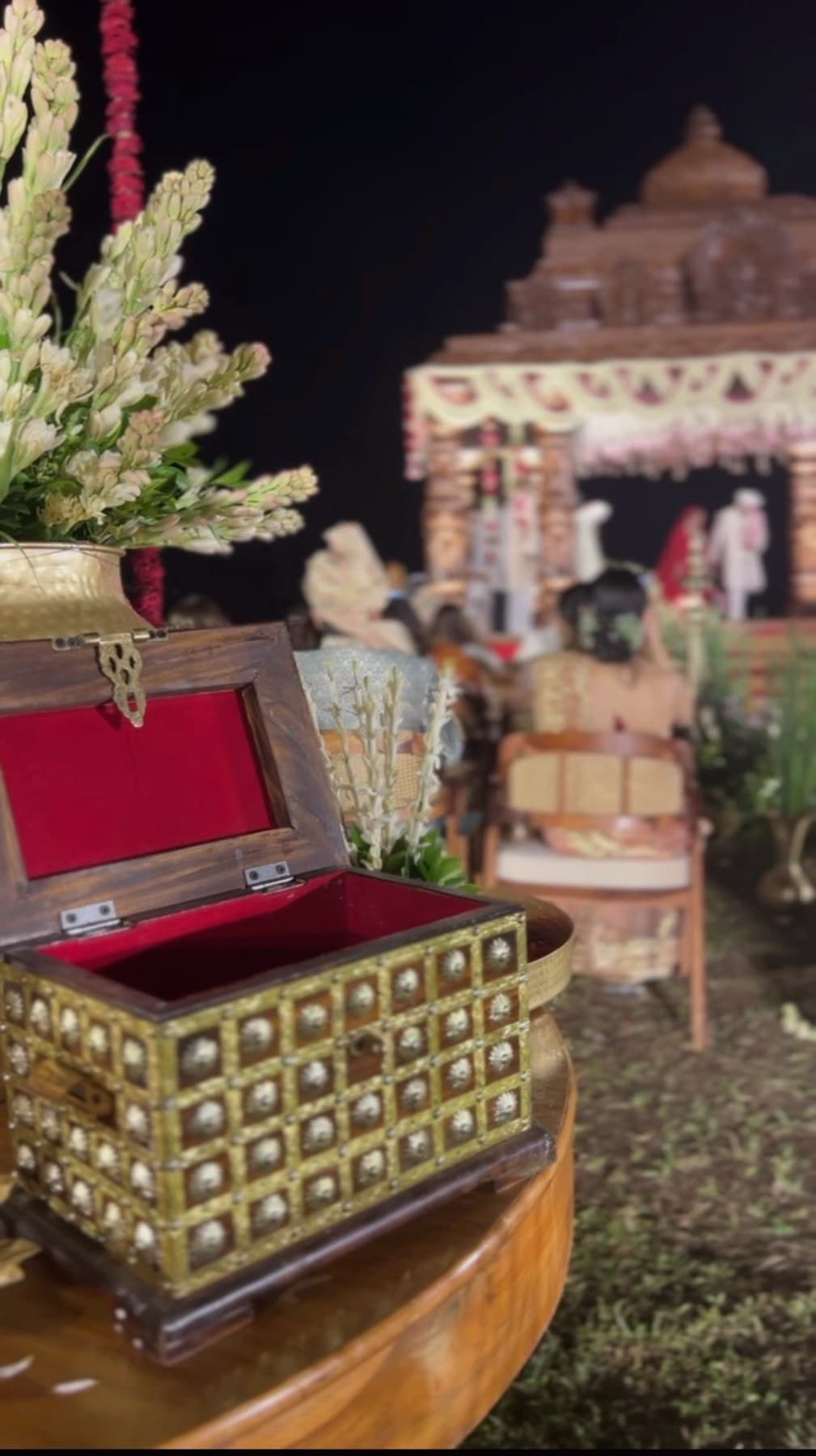 An ornate keepsake box opened at a wedding ceremony